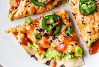 Spicy Salmon Sushi Pizza: Crispy Rice Crust and Fiery Topping