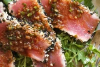 Seared Sesame-Crusted Tuna Steak over Arugula