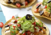 Crispy Nacho-Style Chicken Tostada with Melted Cheese