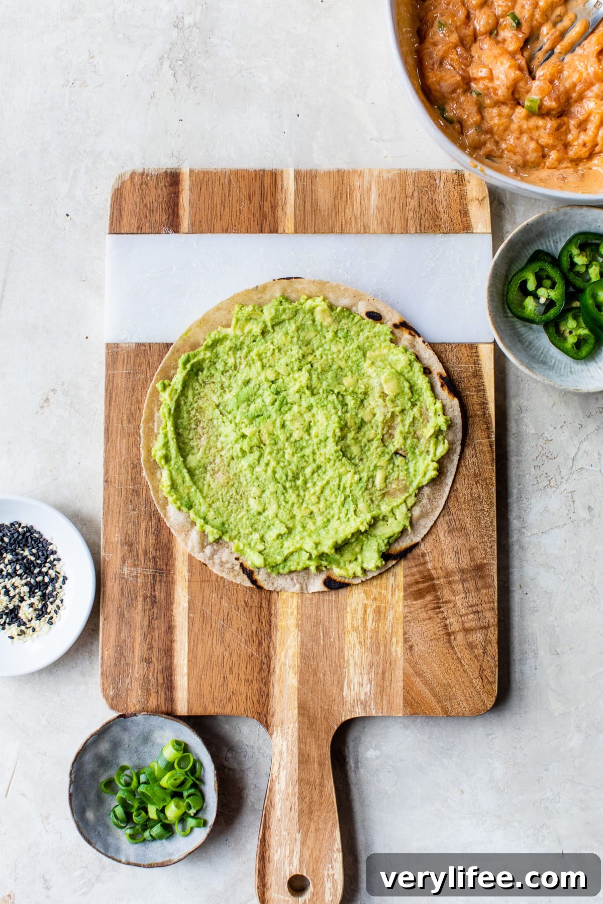 Spicy Salmon Sushi Pizza: Crispy Rice Crust and Fiery Topping 7 tortilla crust with avocado