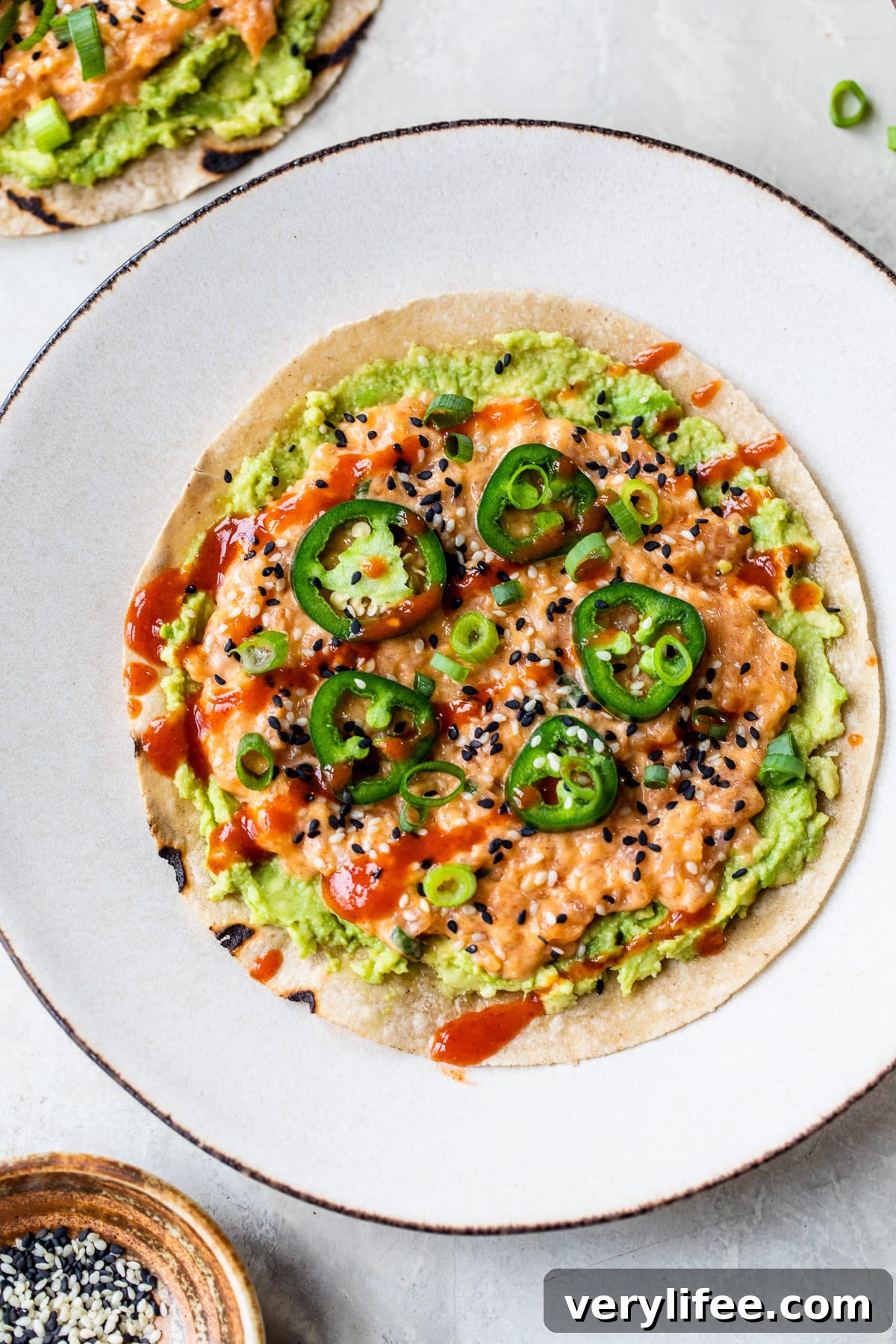 Spicy Salmon Sushi Pizza: Crispy Rice Crust and Fiery Topping 8 Salmon Sushi Pizza with jalapeno
