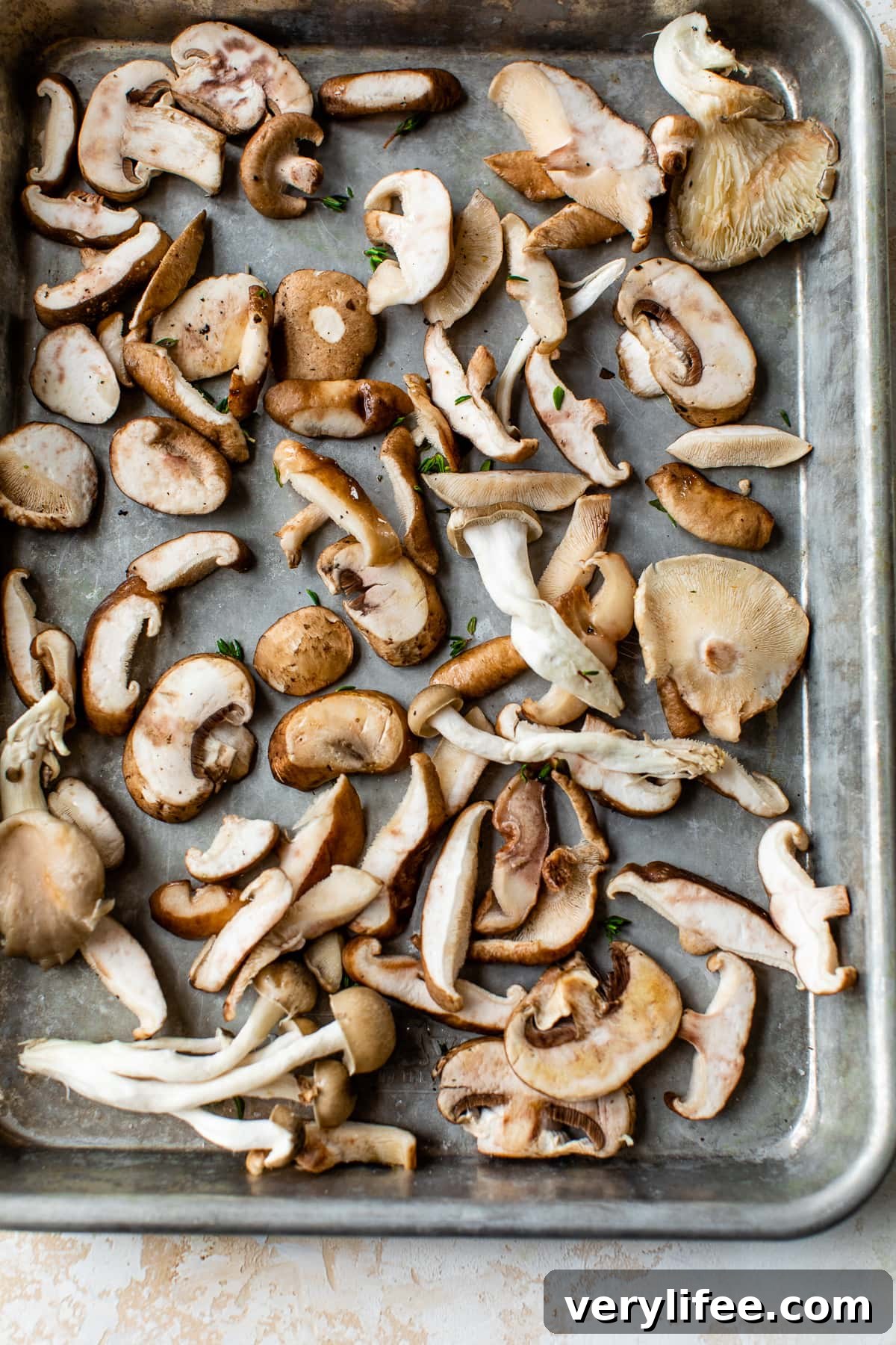 Garlic Parmesan Roasted Mushrooms 3 mushrooms on a sheet pan