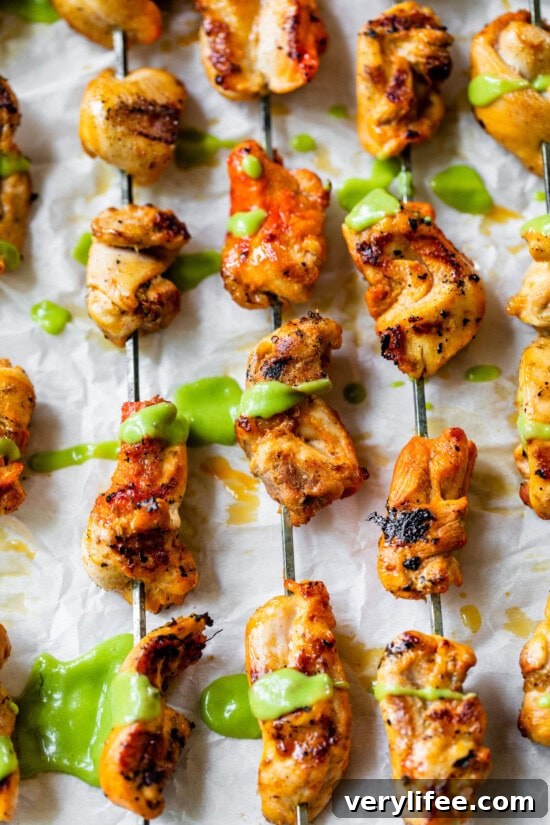 Peruvian grilled chicken skewers with avocado aji sauce