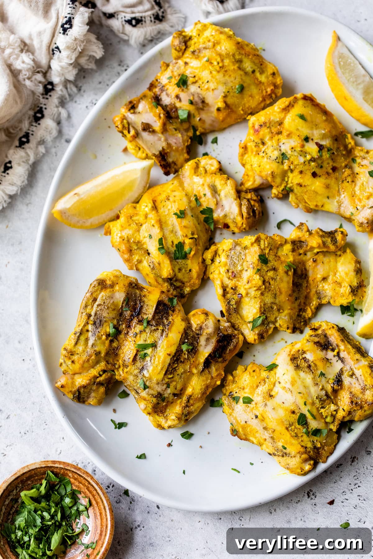 platter of grilled chicken thighs
