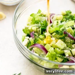Chopped salad with romaine lettuce, Feta cheese, cucumbers, red onion and dill