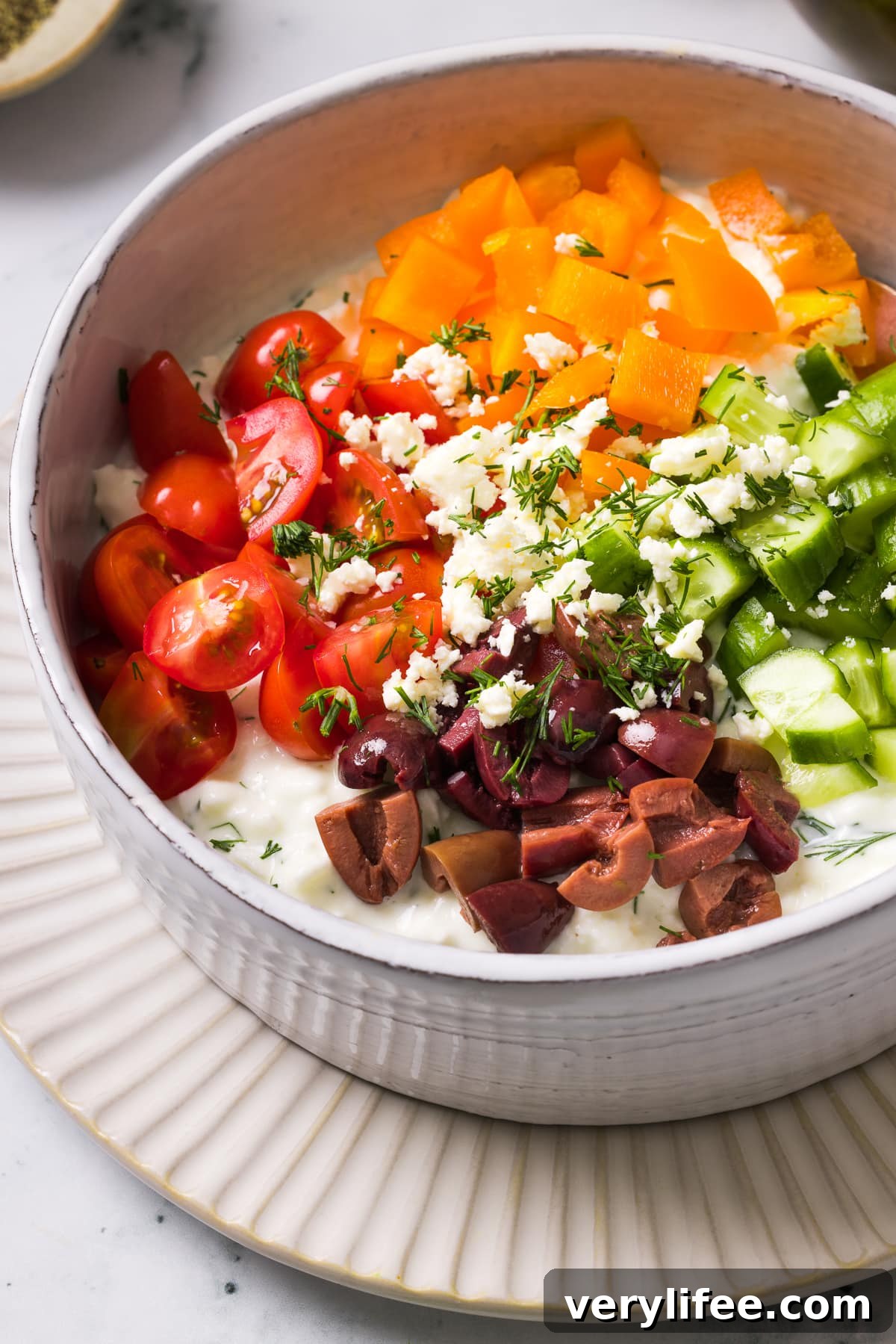 Cottage Cheese with cucumbers, tomatoes, bell peppers and olives