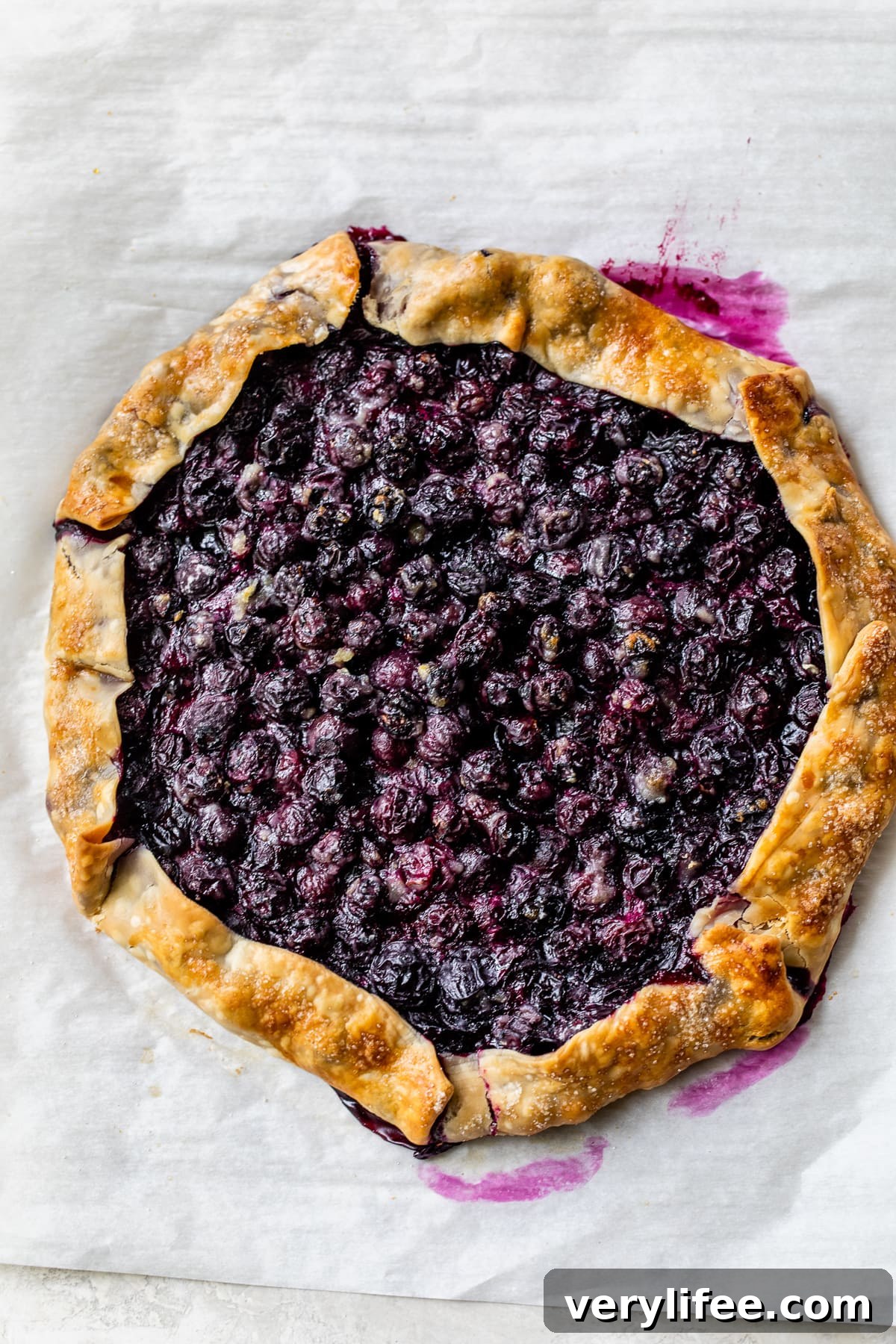 This easy blueberry galette is the perfect dessert to bake when blueberries are in season. Using refrigerated pie dough makes it even faster! Blueberry Tart