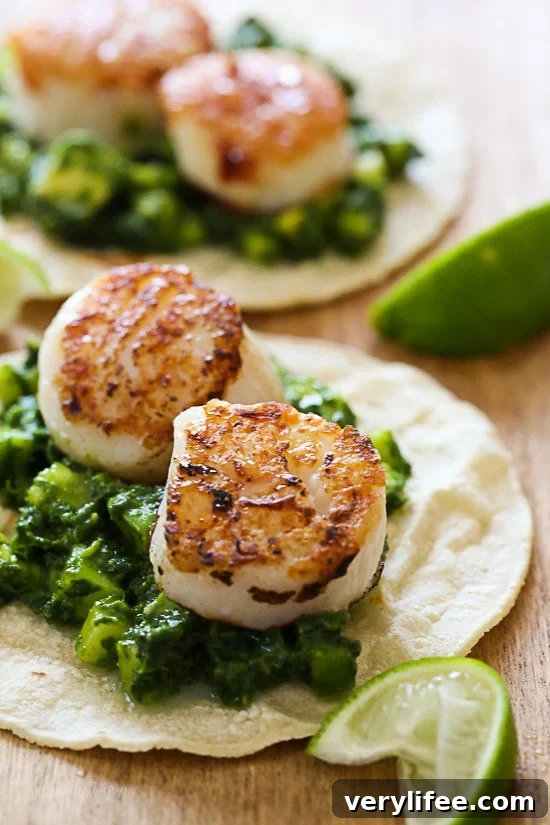 Green Scallop Tacos with a spicy green herb cucumber and avocado salsa and a squeeze of lime juice on top, so good!