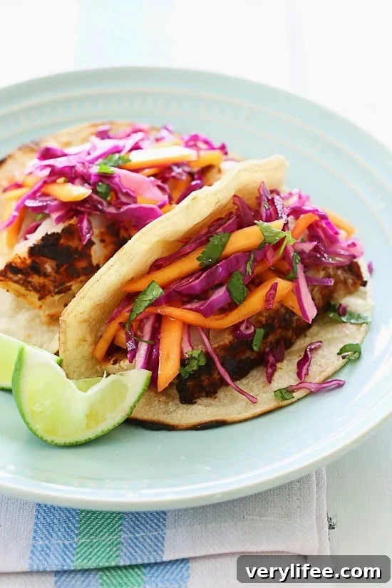 Blackened cod fish seasoned with a spicy rub and cooked in a cast iron skillet. The mango-cabbage slaw is the perfect balance of sweet and sour which compliments the fish perfectly.
