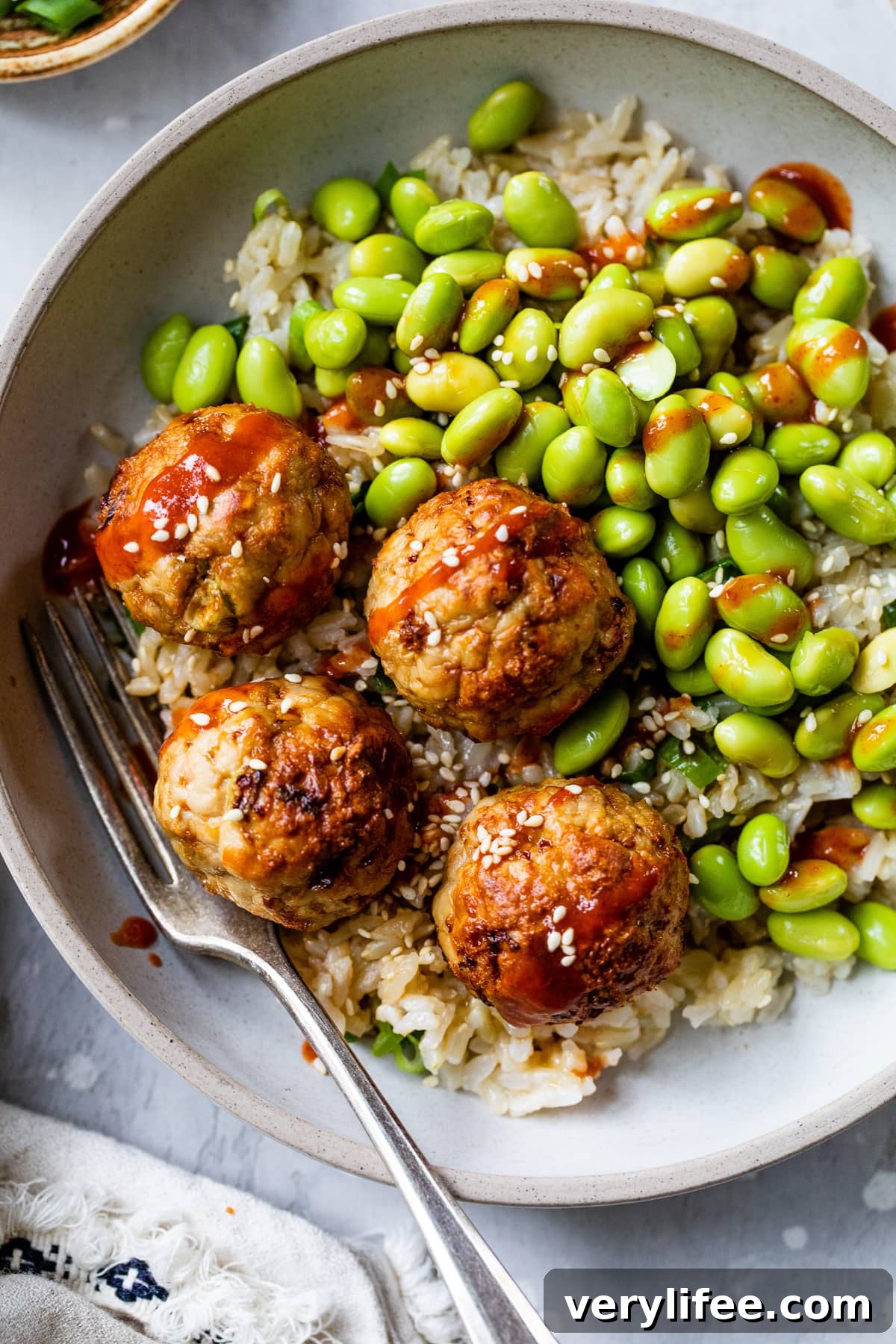 Air Fryer Asian Turkey Meatballs with rice and edamame.