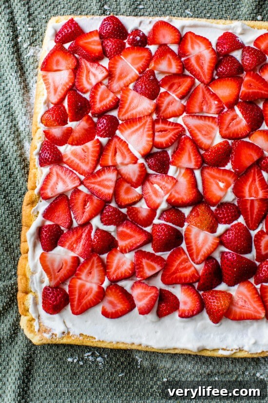 Strawberry Swiss Roll Recipe 8 sponge cake topped with whipped cream and strawberries