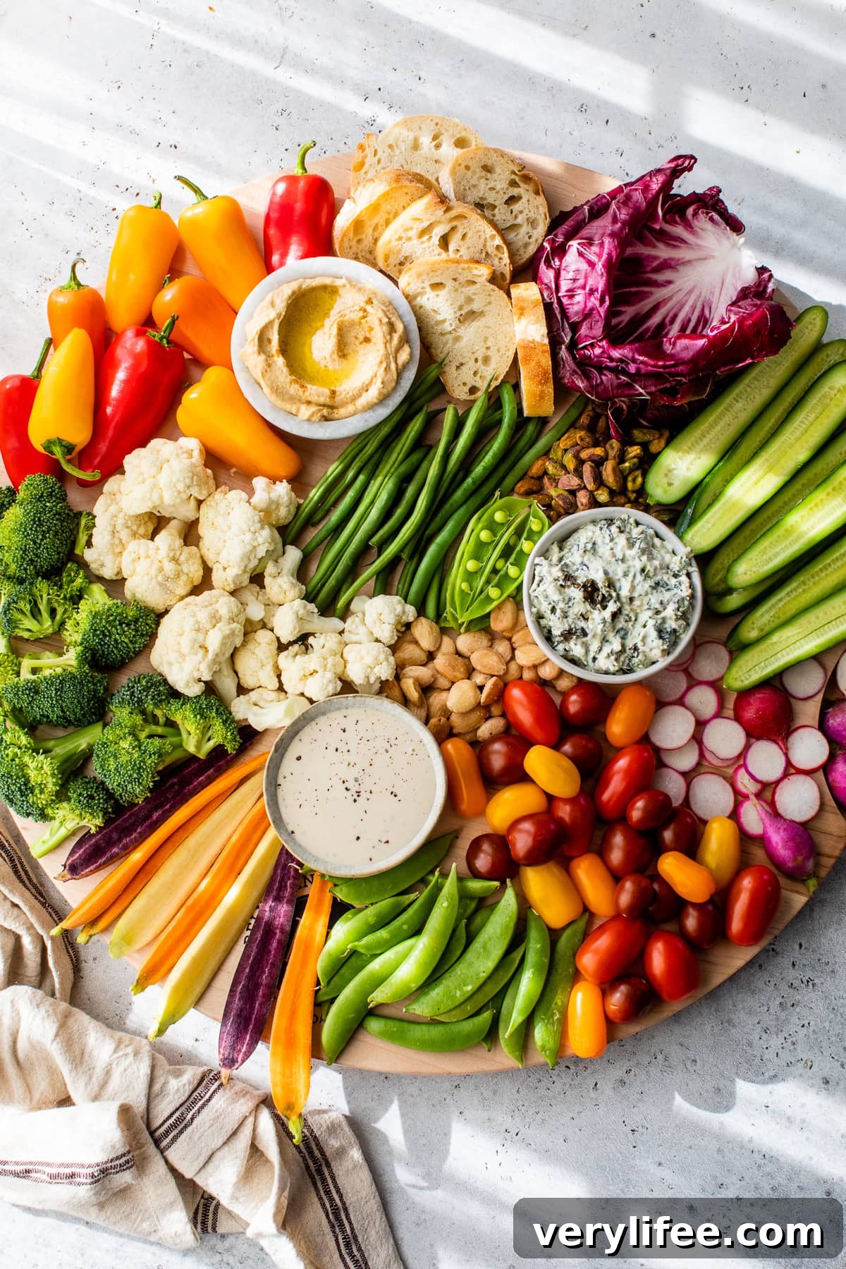 Veggie Tray Ideas for Parties with Dips 2 Overhead view of veggie tray with 3 bowls of dip