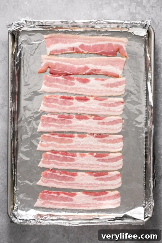 Place cold bacon on a rimmed bacon sheet. Raw bacon on a foil lined baking sheet.