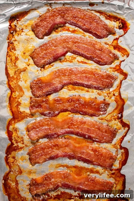 Bake the bacon in the oven. Cooked bacon on foil.