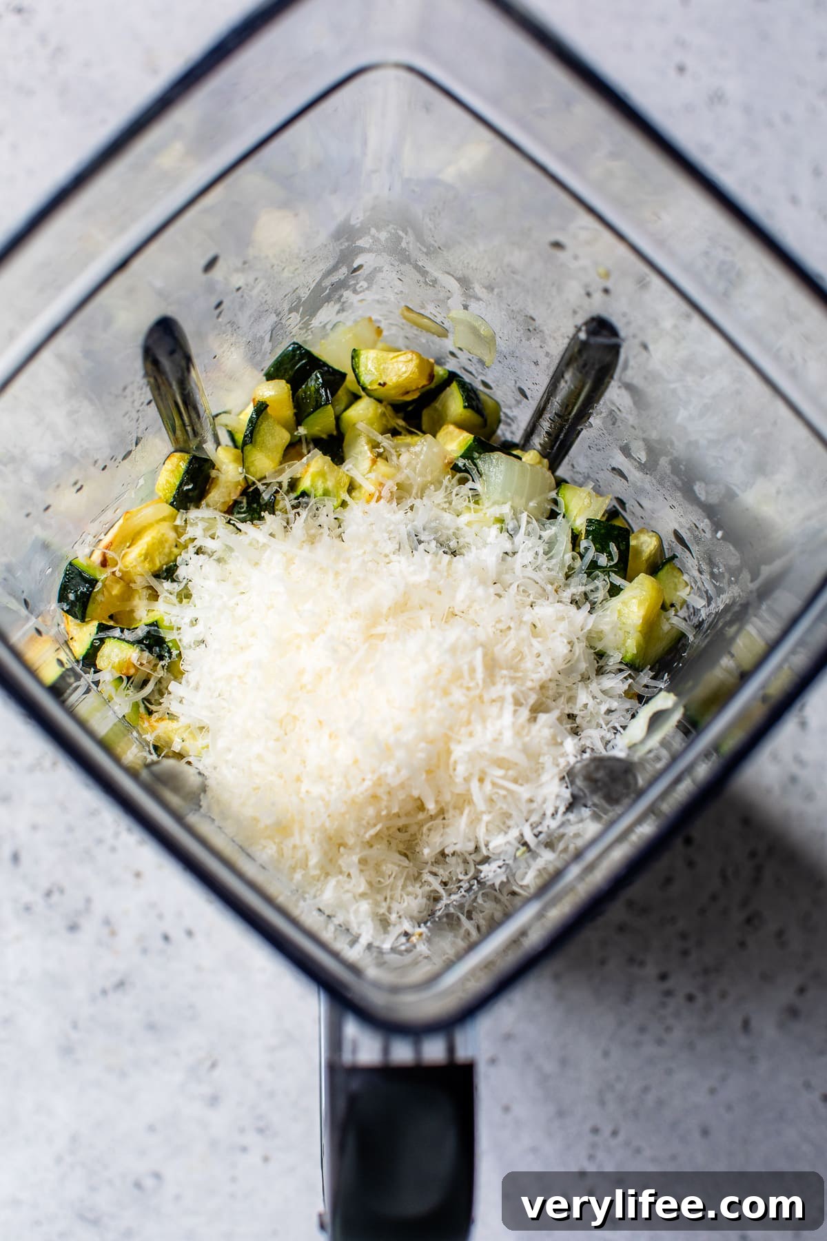 Combine ingredients in the blender. Zucchini and Parmesan cheese in a blender.