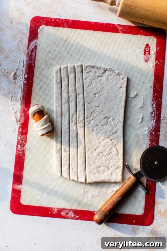 Mummy Hot Dogs: Halloween Party Recipe 5 dough with hot dogs