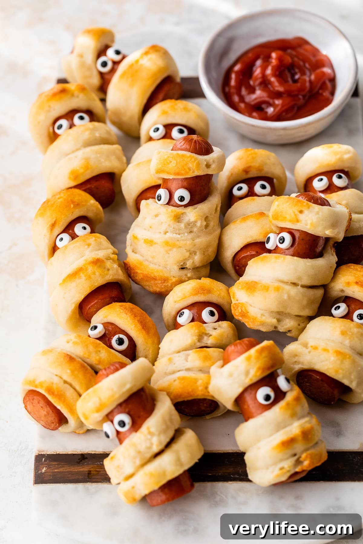 Mummy Hot Dogs: Halloween Party Recipe 7 Mummy Hot Dogs with ketchup