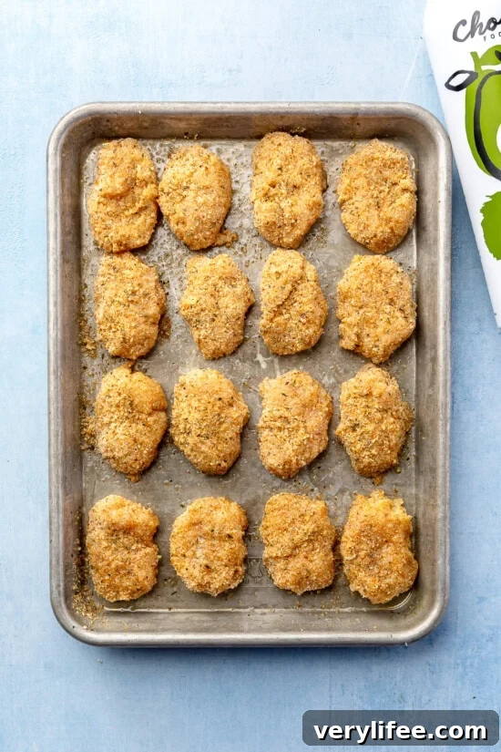 chicken nuggets on a baking sheet