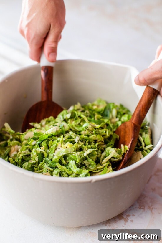 tossing brussels sprout salad