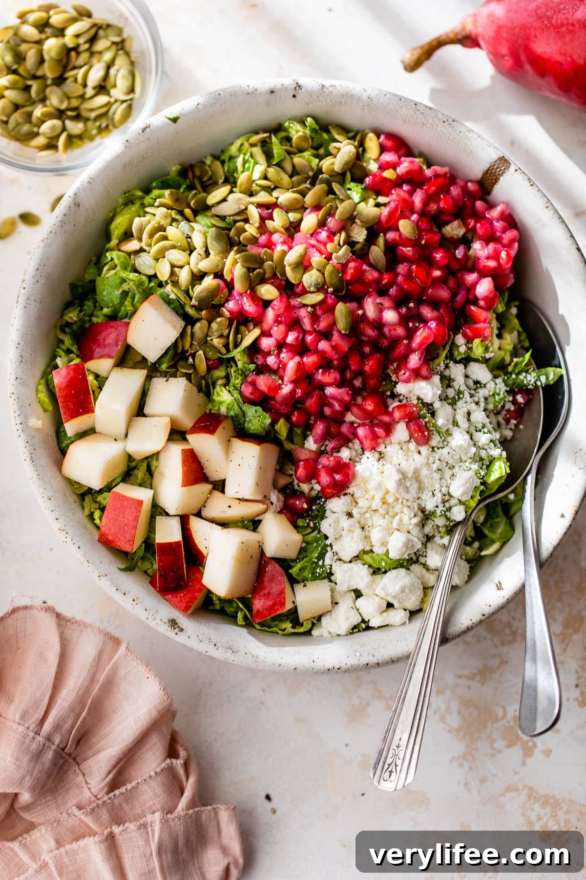 Shaved Brussels Sprouts Salad with Pears, Pomegranate and Pepitas