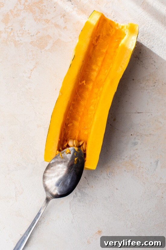 scoop seeds out of delicata squash