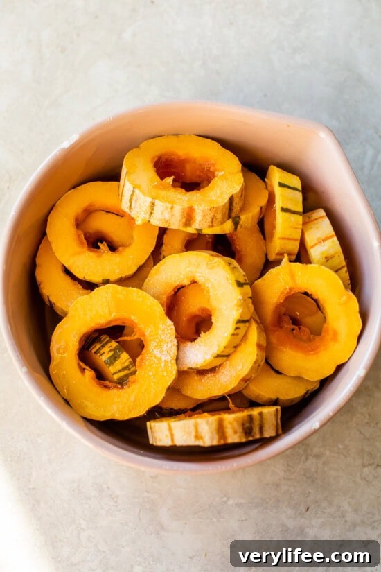 Oven-Roasted Delicata Squash Recipe 7 Remove seeds from the delicata squash and season.