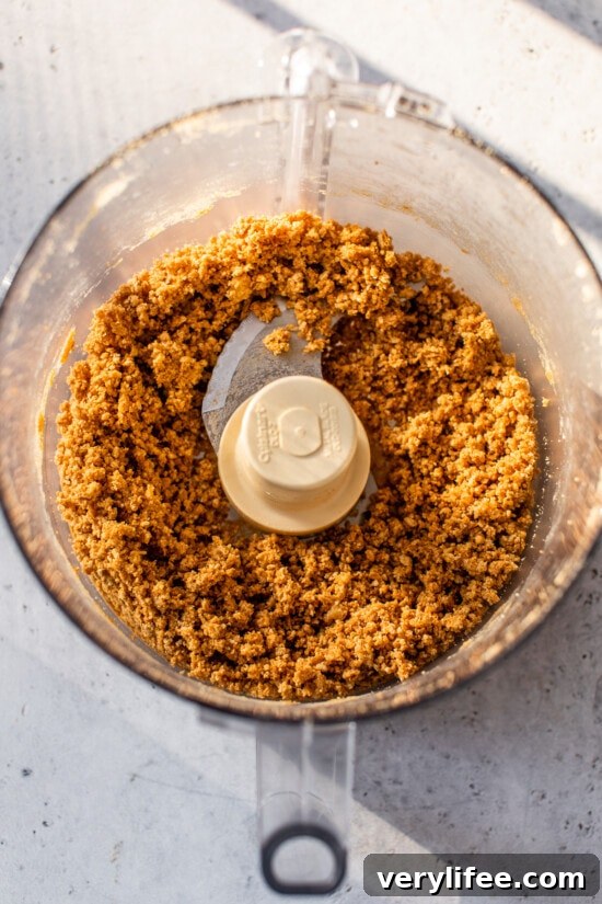 Graham cracker crumbs inside the food processor.