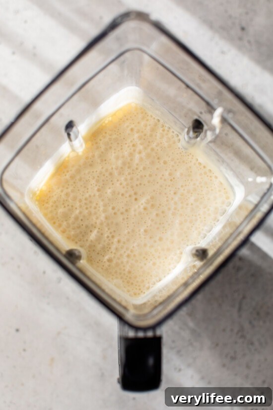 Blended cottage cheese cheesecake batter inside the blender.
