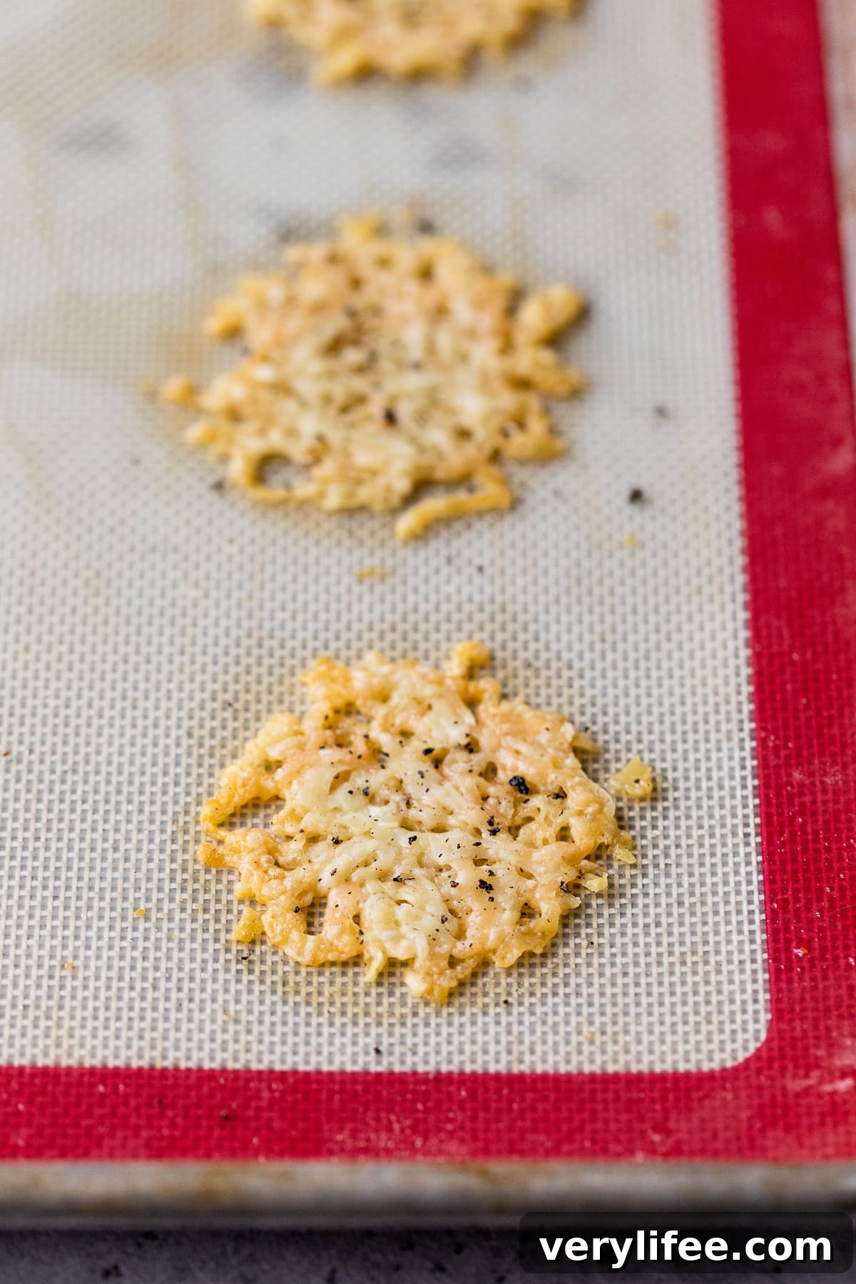Cacio e Pepe Parmesan Cheese Crisps 7 parmesan crisps out of the oven