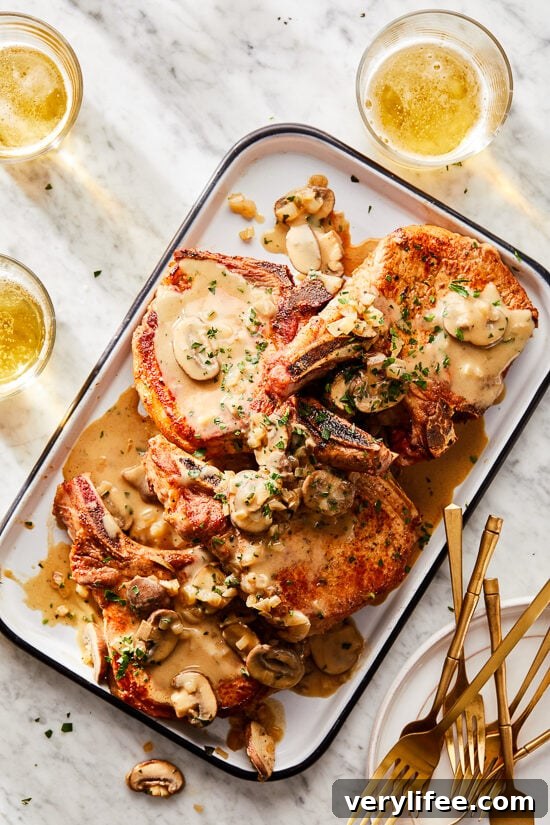 Pork chops with mushrooms and shallots in a creamy Dijon sauce.