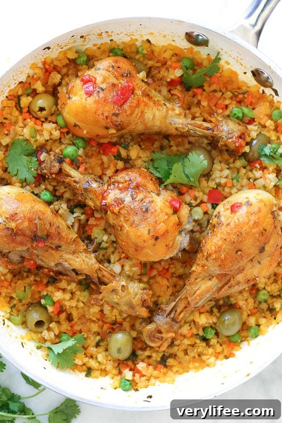 Skillet Cauliflower "Arroz" Con Pollo — a low-carb take on Spanish chicken and rice using cauliflower rice.