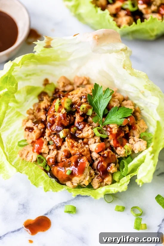 Asian chicken lettuce wraps made with ground chicken, shiitake mushrooms, and water chestnuts.