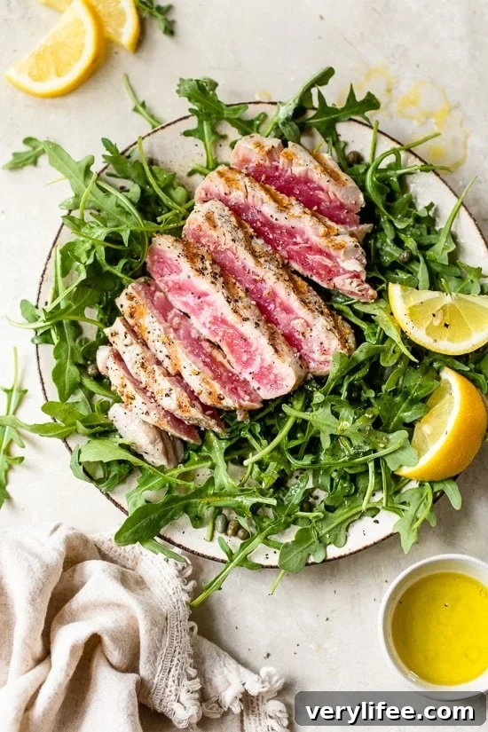 Grilled tuna over arugula with lemon vinaigrette—light and ready in 10 minutes.
