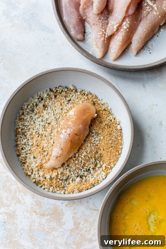 Bread the chicken Chicken tenderloin in a bowl of breading.