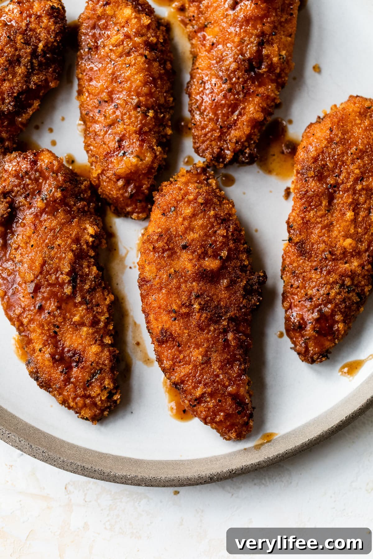 Crispy BBQ chicken tenders ready to serve Crispy BBQ chicken tenders on a plate.