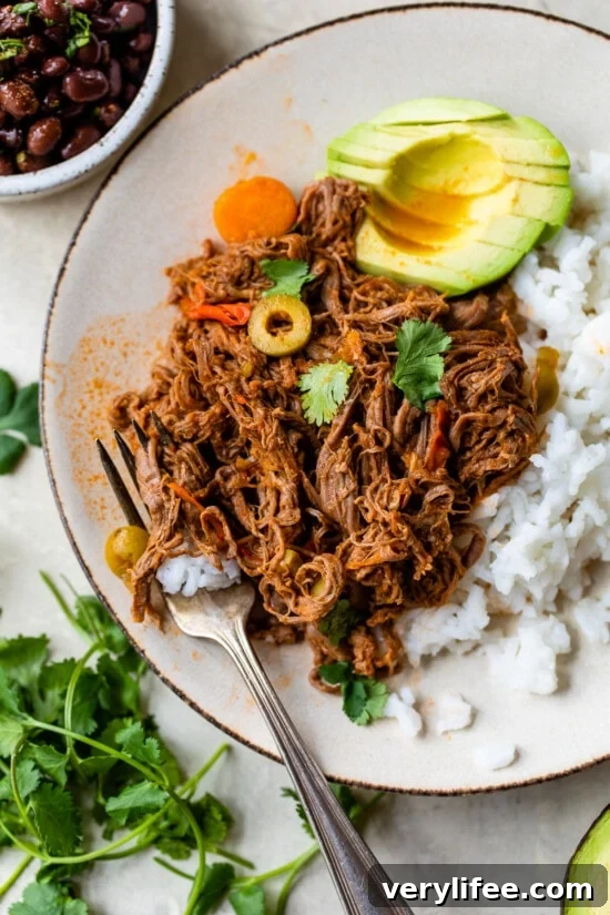 Ropa Vieja with rice and avocado
