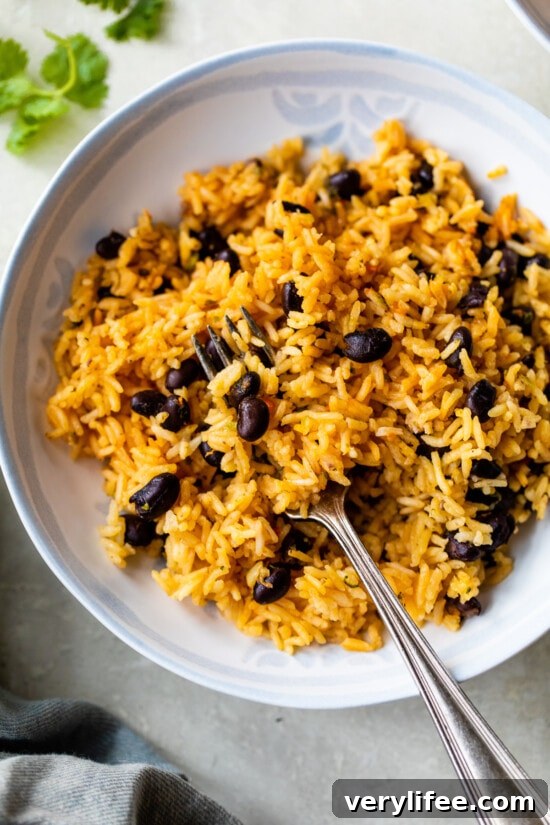rice and black beans with a fork