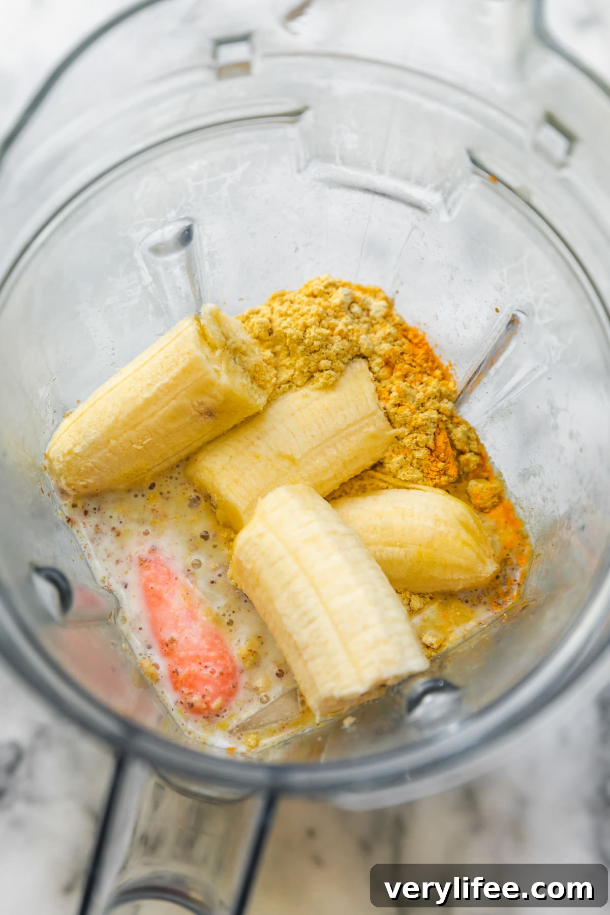 Carrot and Banana Protein Smoothie for Post Workout Recovery 5 Carrots, Bananas, protein powder, flax and almond milk