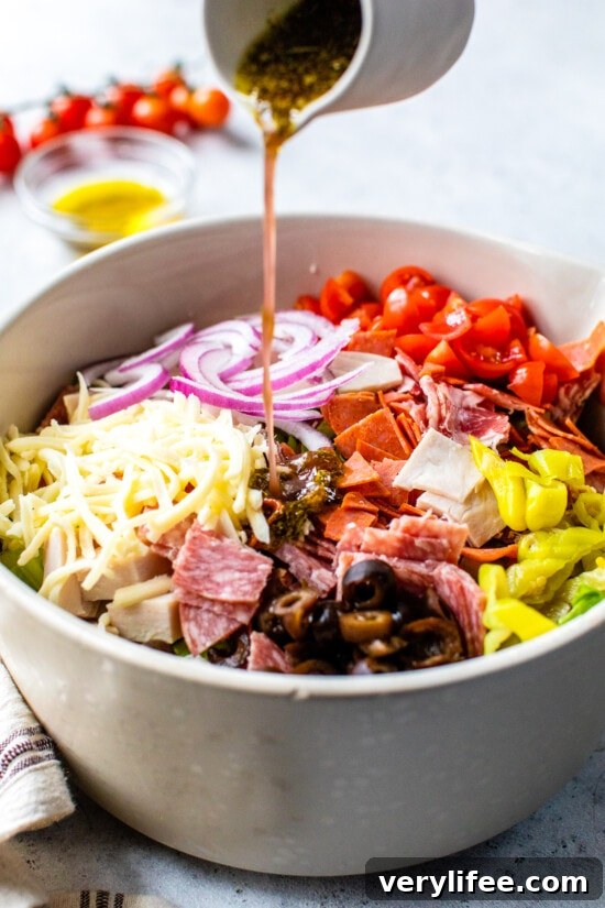 Italian Sub Salad with Salami, Provolone & Pepperoncini 6 adding italian dressing to salad