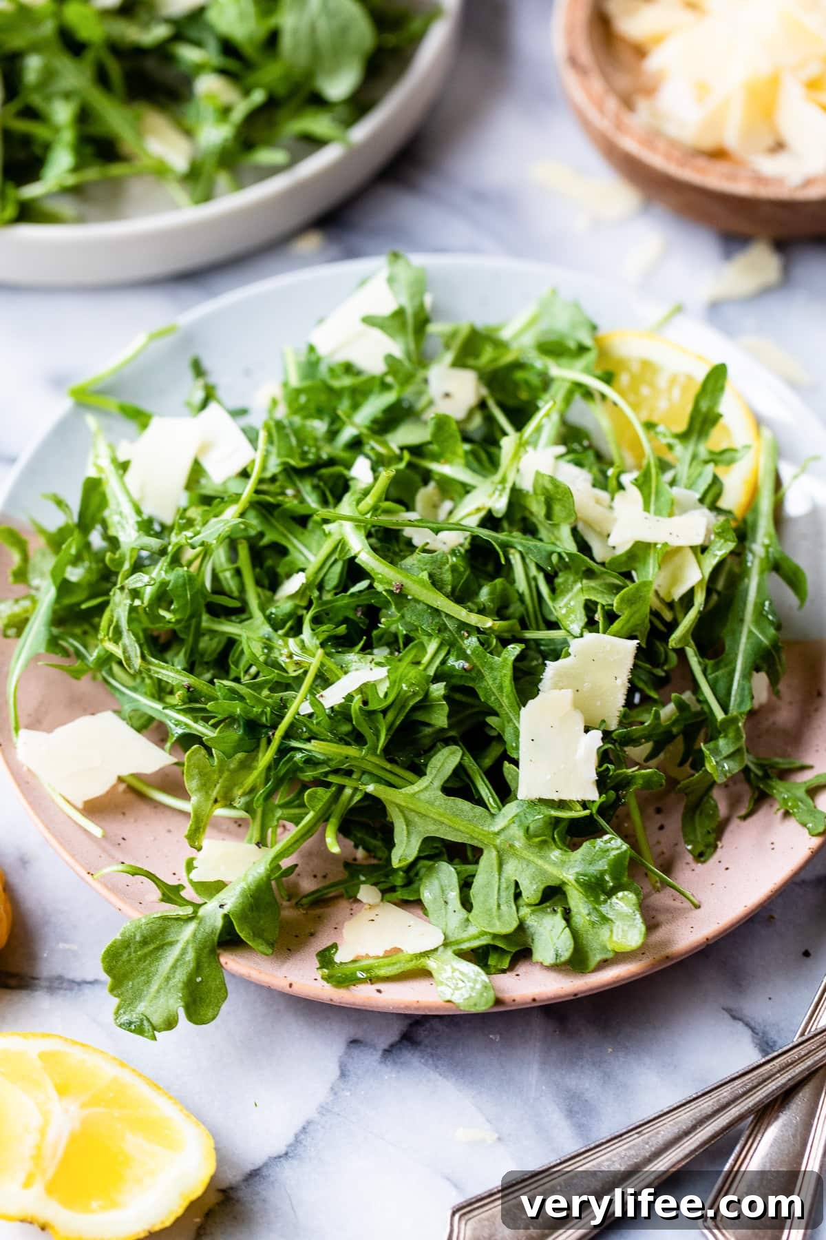 Arugula Salad with Lemon Vinaigrette and Parmesan 2 plated arugula salad