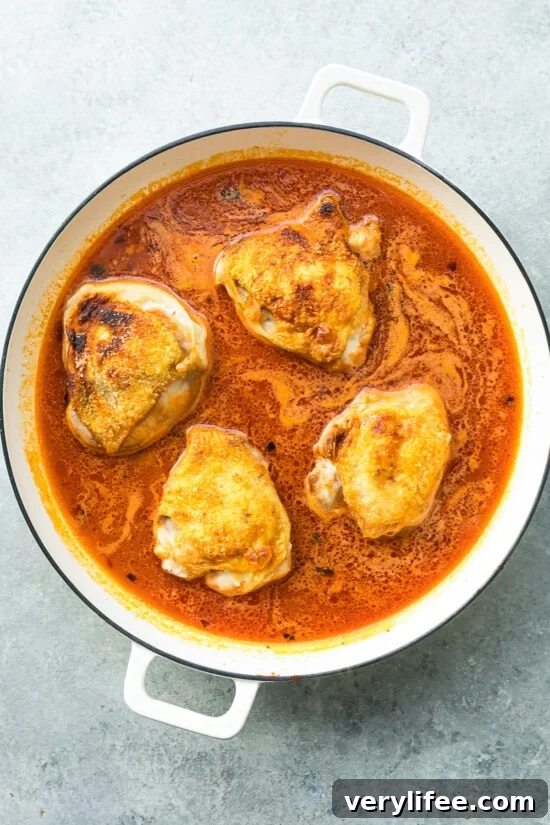 One-Pot Chicken and Orzo Recipe 8 add chicken thighs to the pot with orzo