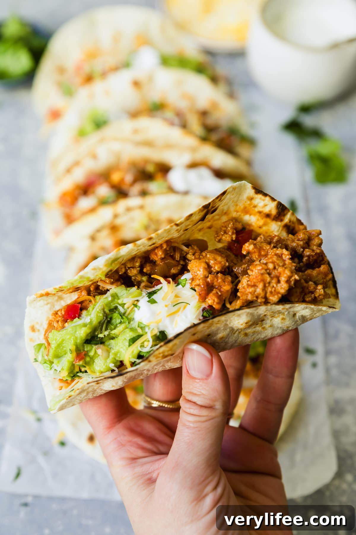 Savory Ground Turkey Tacos with Avocado Crema 9 Turkey Taco in hand