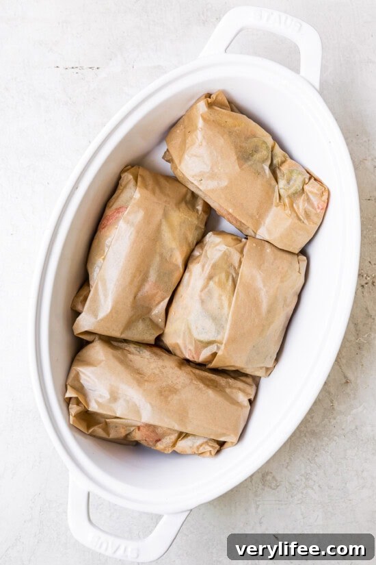 Parchment-Baked Fish: How to Cook En Papillote 8 Fold the parchment and place on a baking dish.