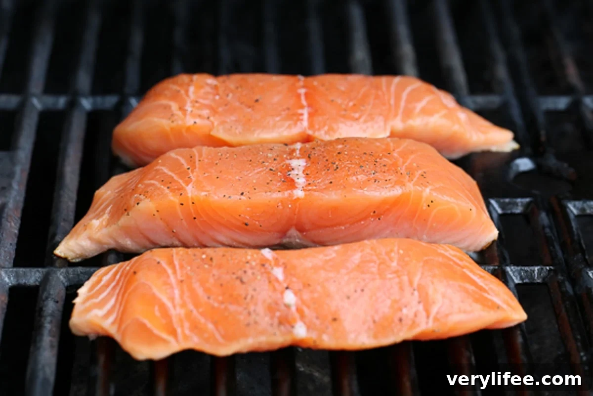 Top 4 Charcoal Grills for Summer Barbecues 7 grilling salmon on an outdoor grill