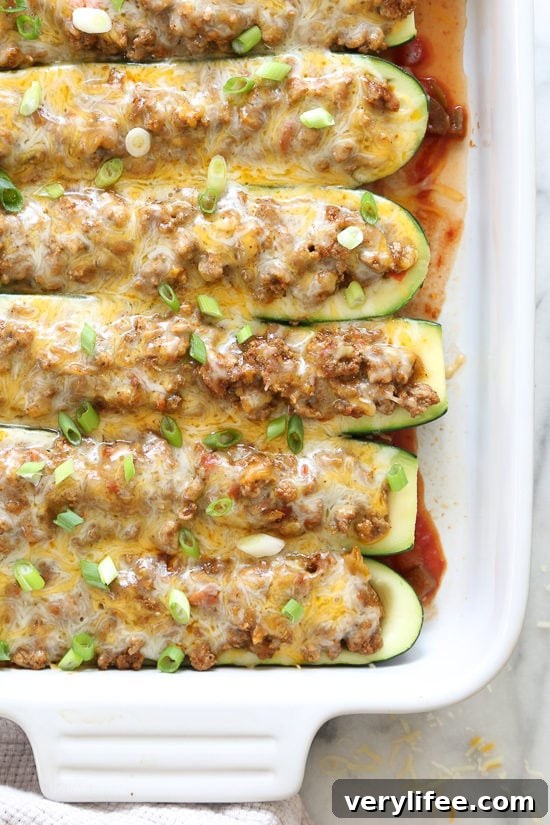These low-carb stuffed turkey taco zucchini boats are so easy, a fun twist on taco night!