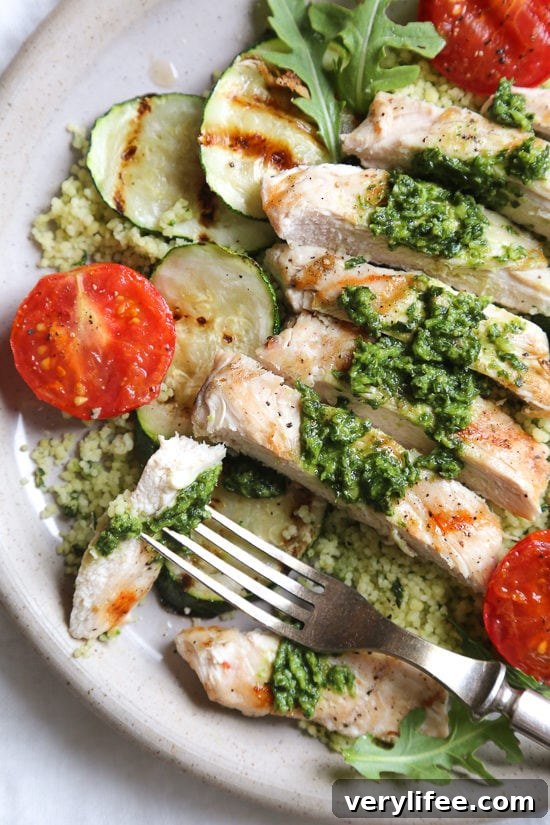Grilled chicken, zucchini and tomatoes topped with a light spinach-arugula basil pesto served over couscous.