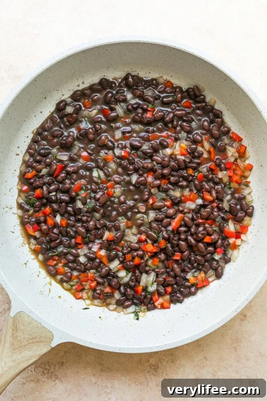 Gallo Pinto: Costa Rican Rice and Beans Recipe 8 Add the black beans.