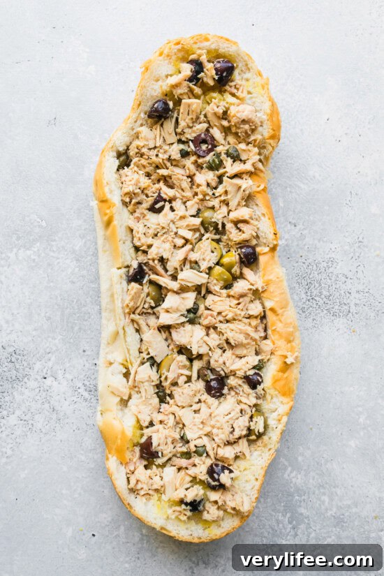 Pan Bagnat: Nicoise Tuna Sandwich 7 Fill the scooped out bread with tuna salad.