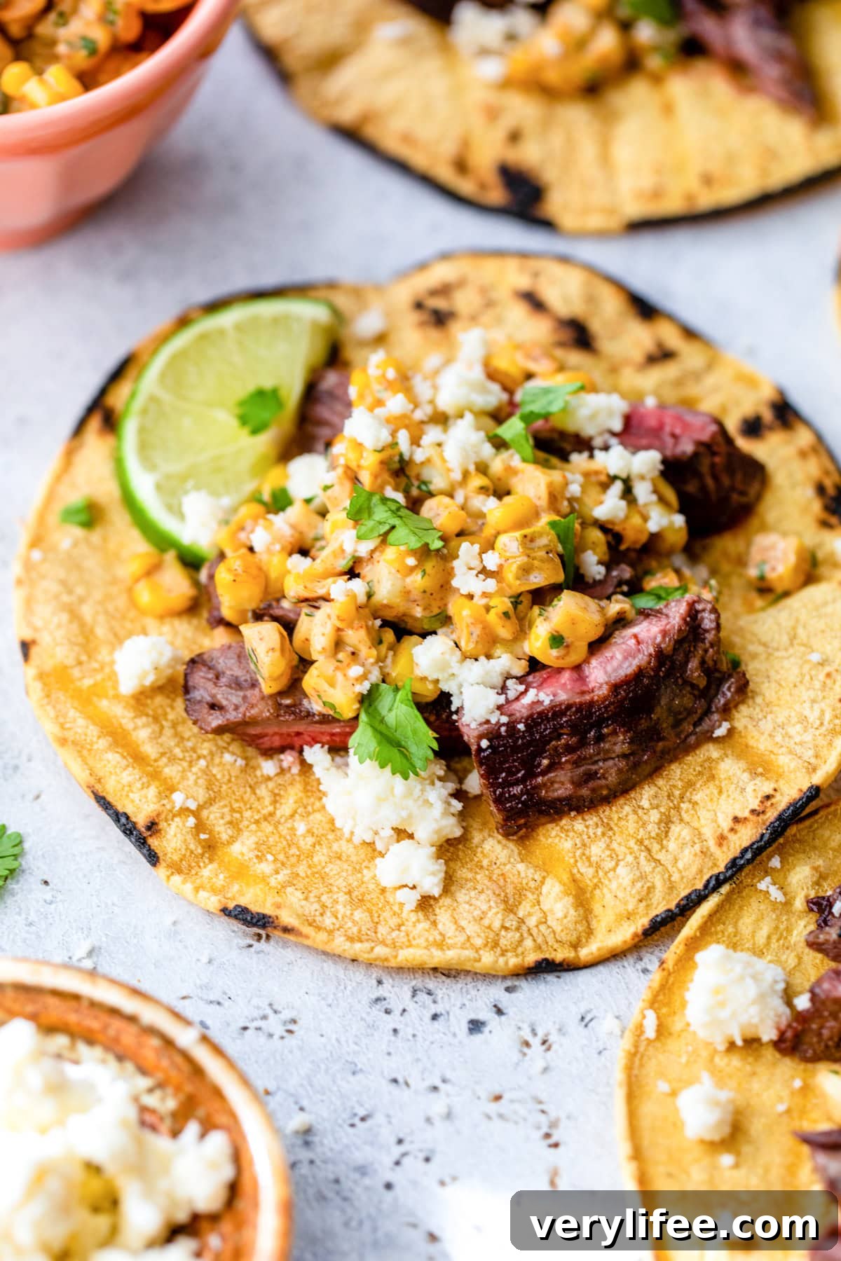 Grilled Skirt Steak tacos with corn and lime