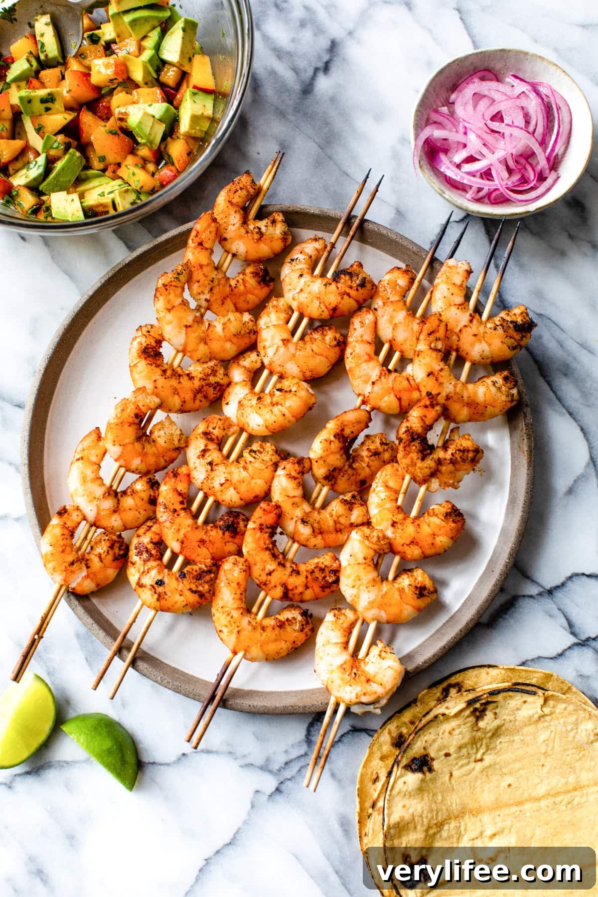 Grilled Shrimp Tacos with Fresh Peach Salsa Recipe 5 grilled shrimp on skewers with tortillas and peach salsa